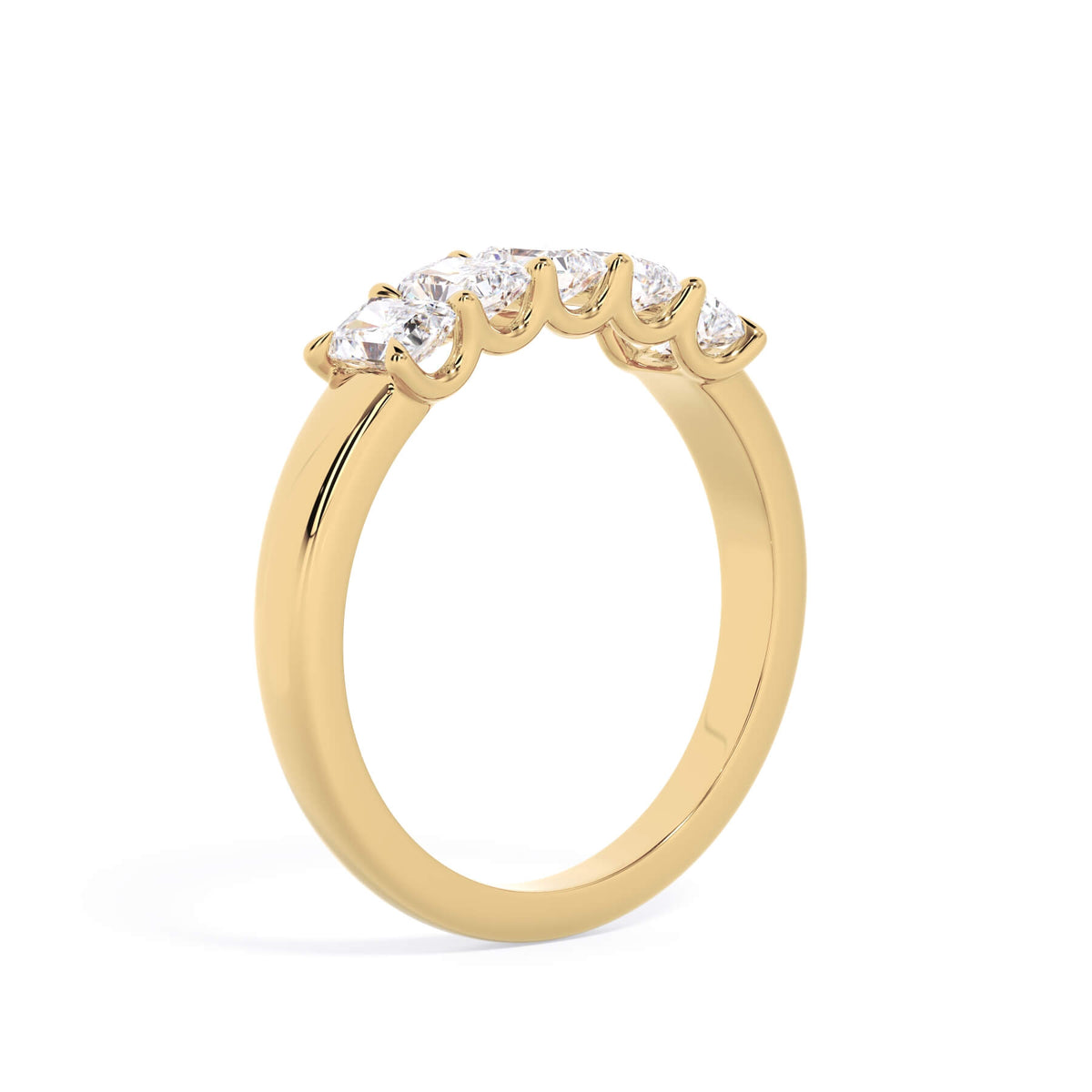 A picture of a five stone diamond wedding ring with radiant cut diamonds that are u prong set in yellow gold on a white background with a slightly angled, through the finger view.