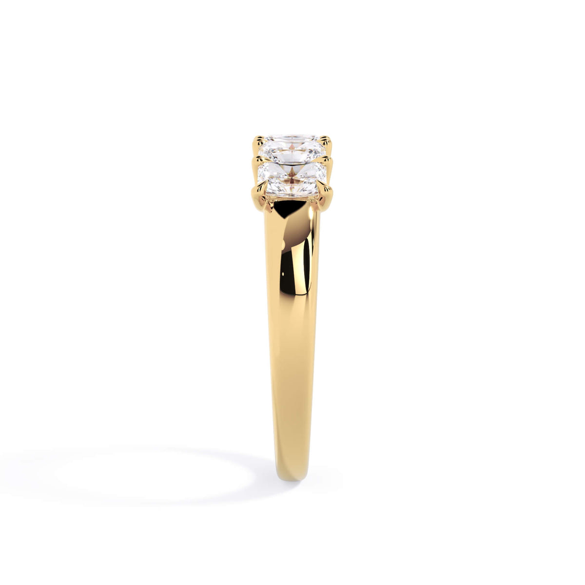 A picture of a five stone diamond wedding ring with radiant cut diamonds that are u prong set in yellow gold on a white background with a side profile view.