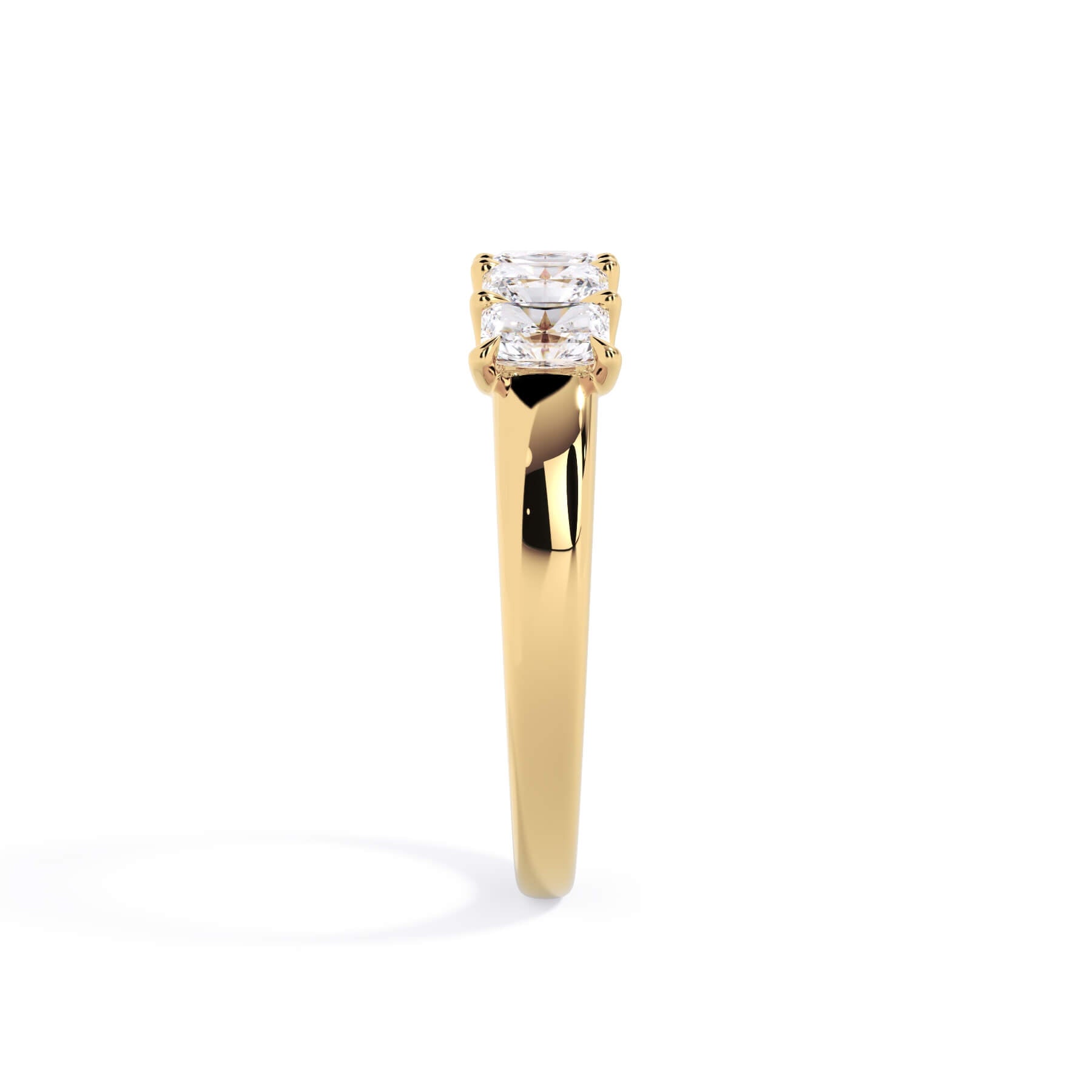A picture of a five stone diamond wedding ring with radiant cut diamonds that are u prong set in yellow gold on a white background with a side profile view.