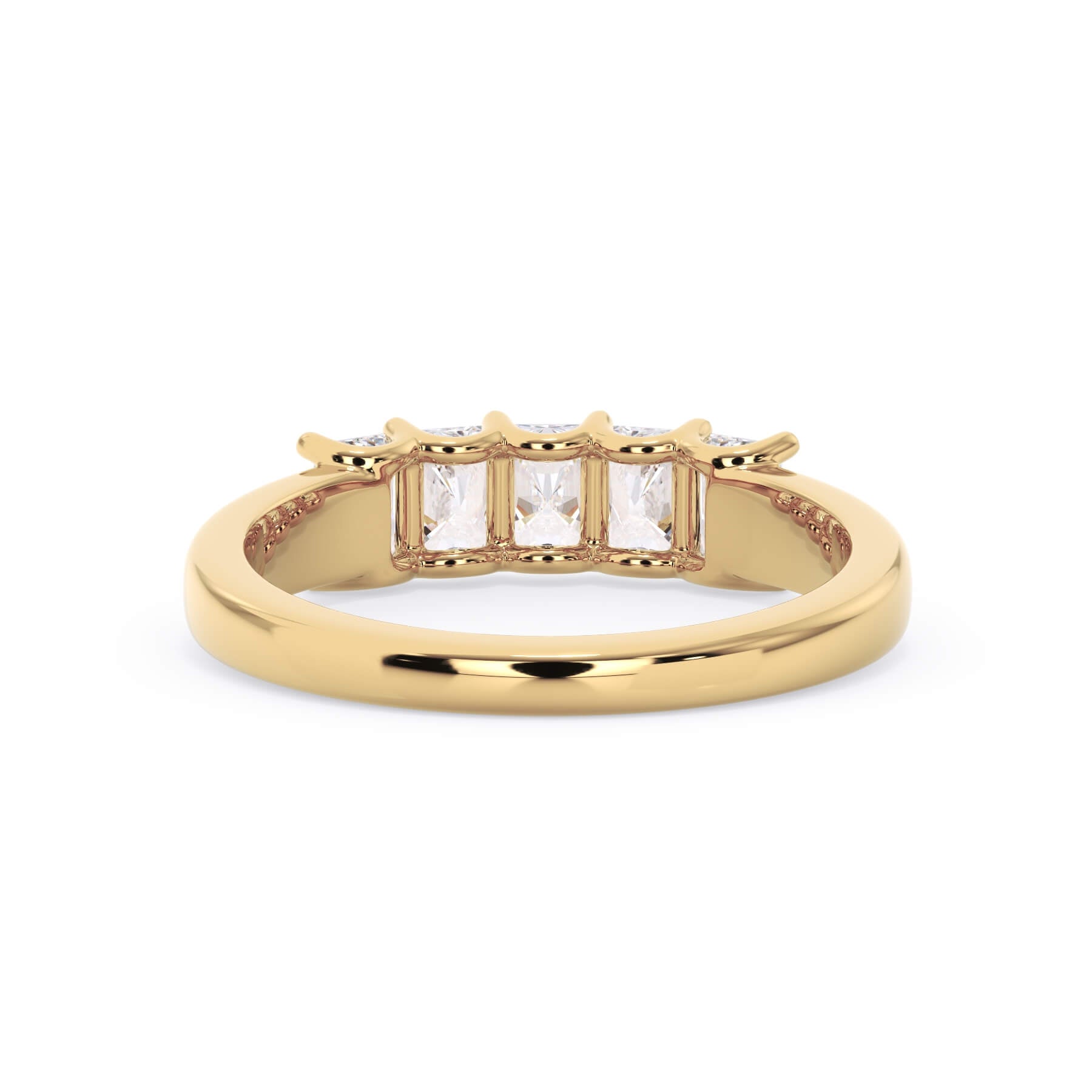 A picture of a five stone diamond wedding ring with radiant cut diamonds that are u prong set in yellow gold on a white background with a view of the underside of the ring.