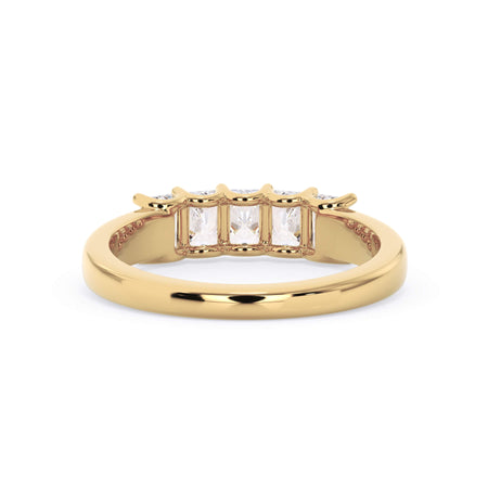 A picture of a five stone diamond wedding ring with radiant cut diamonds that are u prong set in yellow gold on a white background with a view of the underside of the ring.