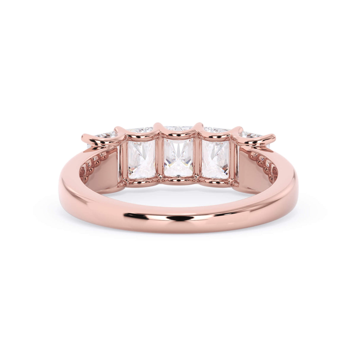 A picture of a five stone diamond wedding ring with radiant cut diamonds that are u prong set in rose gold on a white background with a view of the underside of the ring.