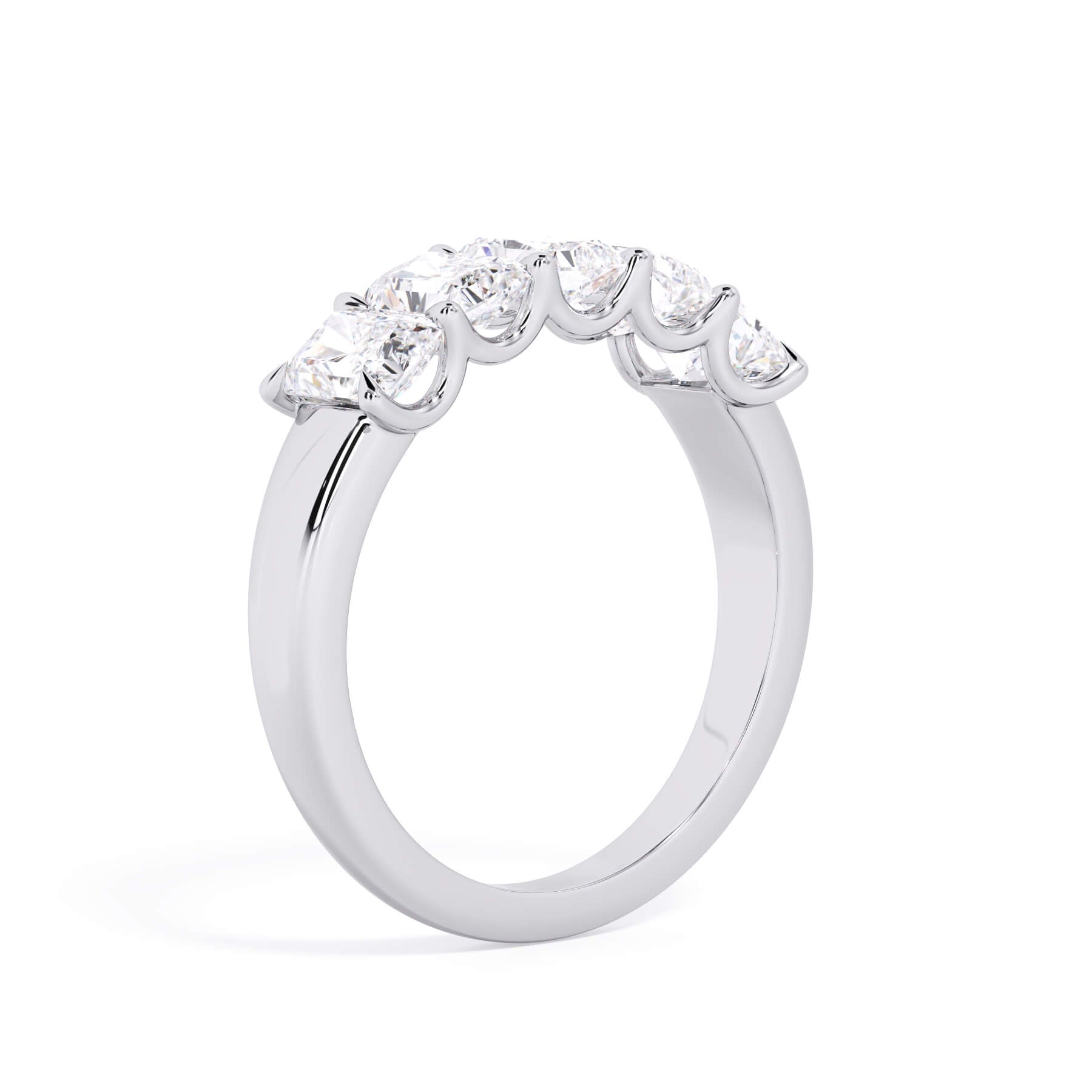 A picture of a five stone diamond wedding ring with radiant cut diamonds that are u prong set in white gold or platinum on a white background with a slightly angled, through the finger view.