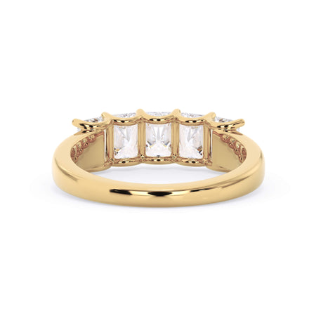 A picture of a five stone diamond wedding ring with radiant cut diamonds that are u prong set in yellow gold on a white background with a view of the underside of the ring.