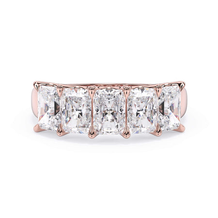 A picture of a five stone diamond wedding ring with radiant cut diamonds that are u prong set in rose gold on a white background with the ring facing forward, lying down.