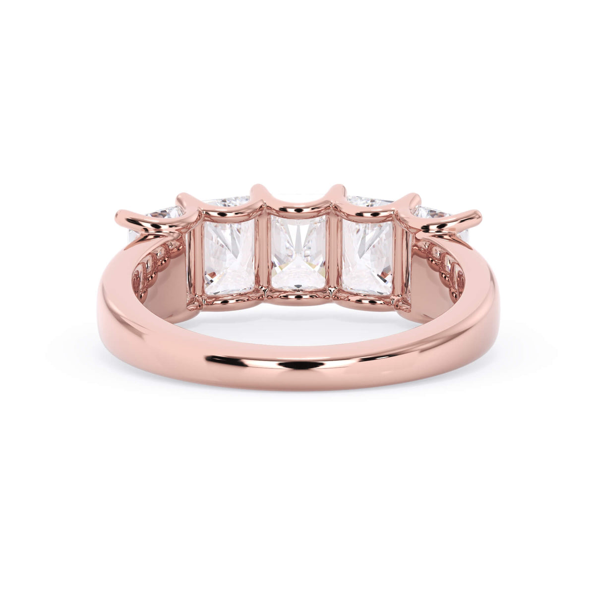 A picture of a five stone diamond wedding ring with radiant cut diamonds that are u prong set in rose gold on a white background with a view of the underside of the ring.