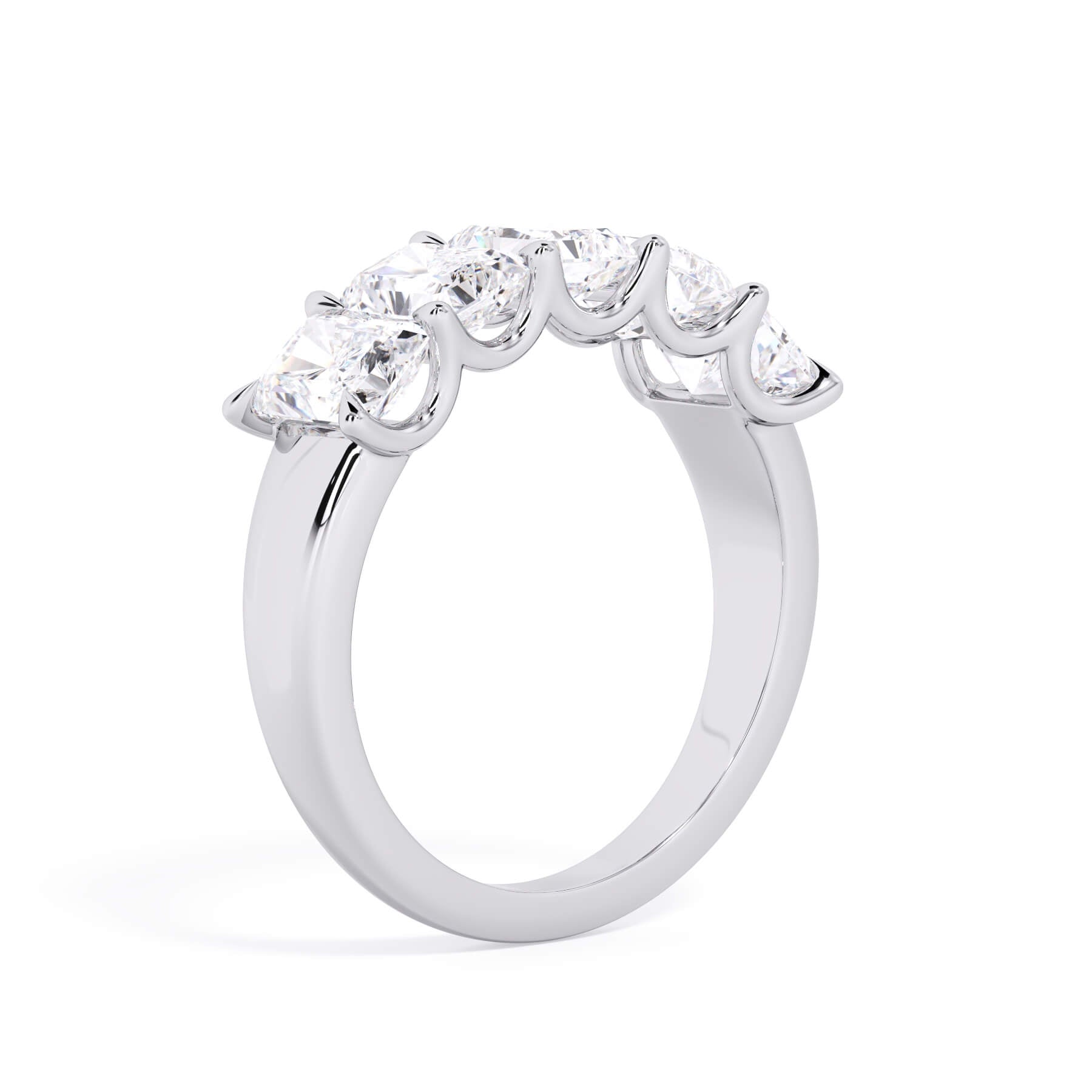 A picture of a five stone diamond wedding ring with radiant cut diamonds that are u prong set in white gold or platinum on a white background with a slightly angled, through the finger view.