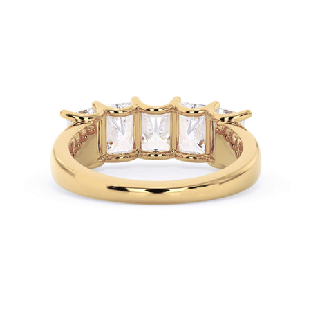 A picture of a five stone diamond wedding ring with radiant cut diamonds that are u prong set in yellow gold on a white background with a view of the underside of the ring.