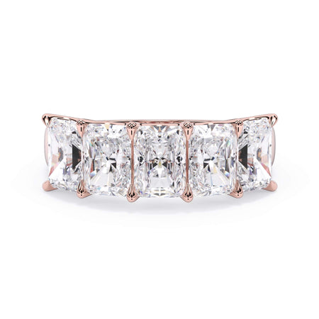 A picture of a five stone diamond wedding ring with radiant cut diamonds that are u prong set in rose gold on a white background with the ring facing forward, lying down.