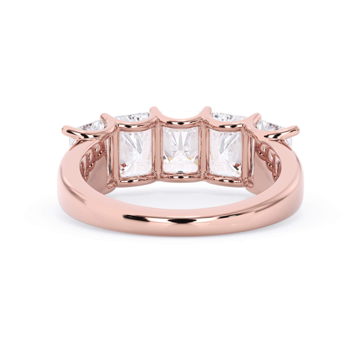 A picture of a five stone diamond wedding ring with radiant cut diamonds that are u prong set in rose gold on a white background with a view of the underside of the ring.