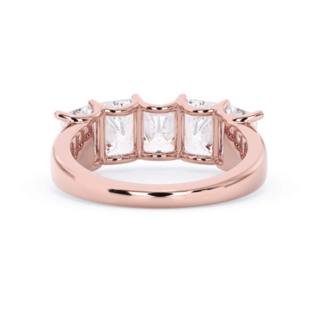 A picture of a five stone diamond wedding ring with radiant cut diamonds that are u prong set in rose gold on a white background with a view of the underside of the ring.