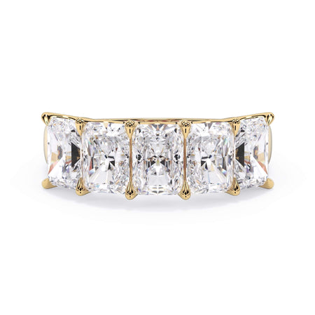 A picture of a five stone diamond wedding ring with radiant cut diamonds that are u prong set in yellow gold on a white background with the ring facing forward, lying down.
