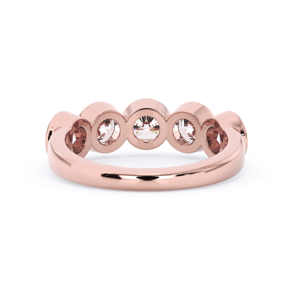 A picture of a five stone diamond wedding ring with round diamonds that are bezel set in rose gold on a white background with a view of the underside of the ring.