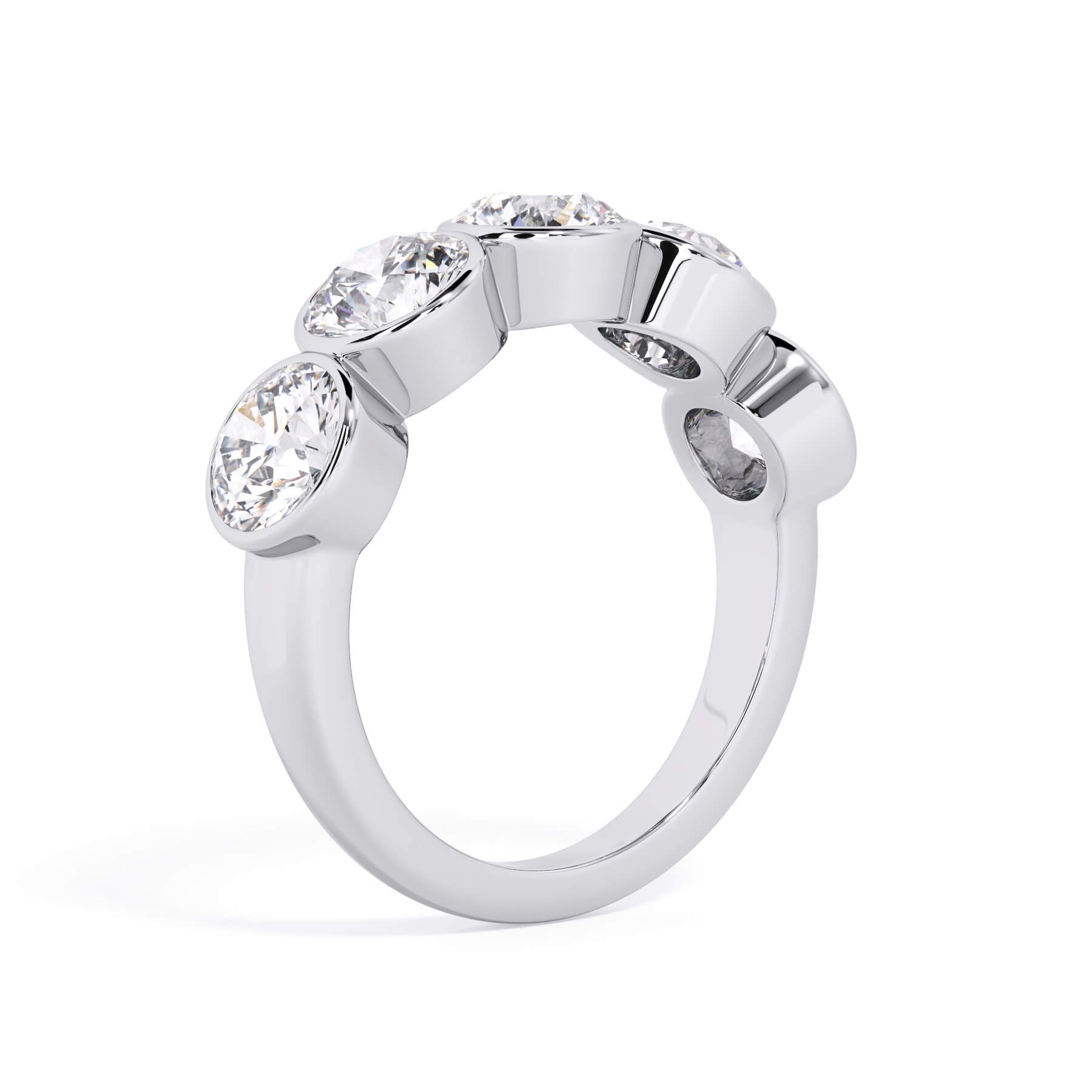 A picture of a five stone diamond wedding ring with round diamonds that are bezel set in white gold or platinum on a white background with a slightly angled, through the finger view.
