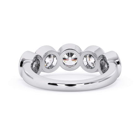 A picture of a five stone diamond wedding ring with round diamonds that are bezel set in white gold or platinum on a white background with a view of the underside of the ring.