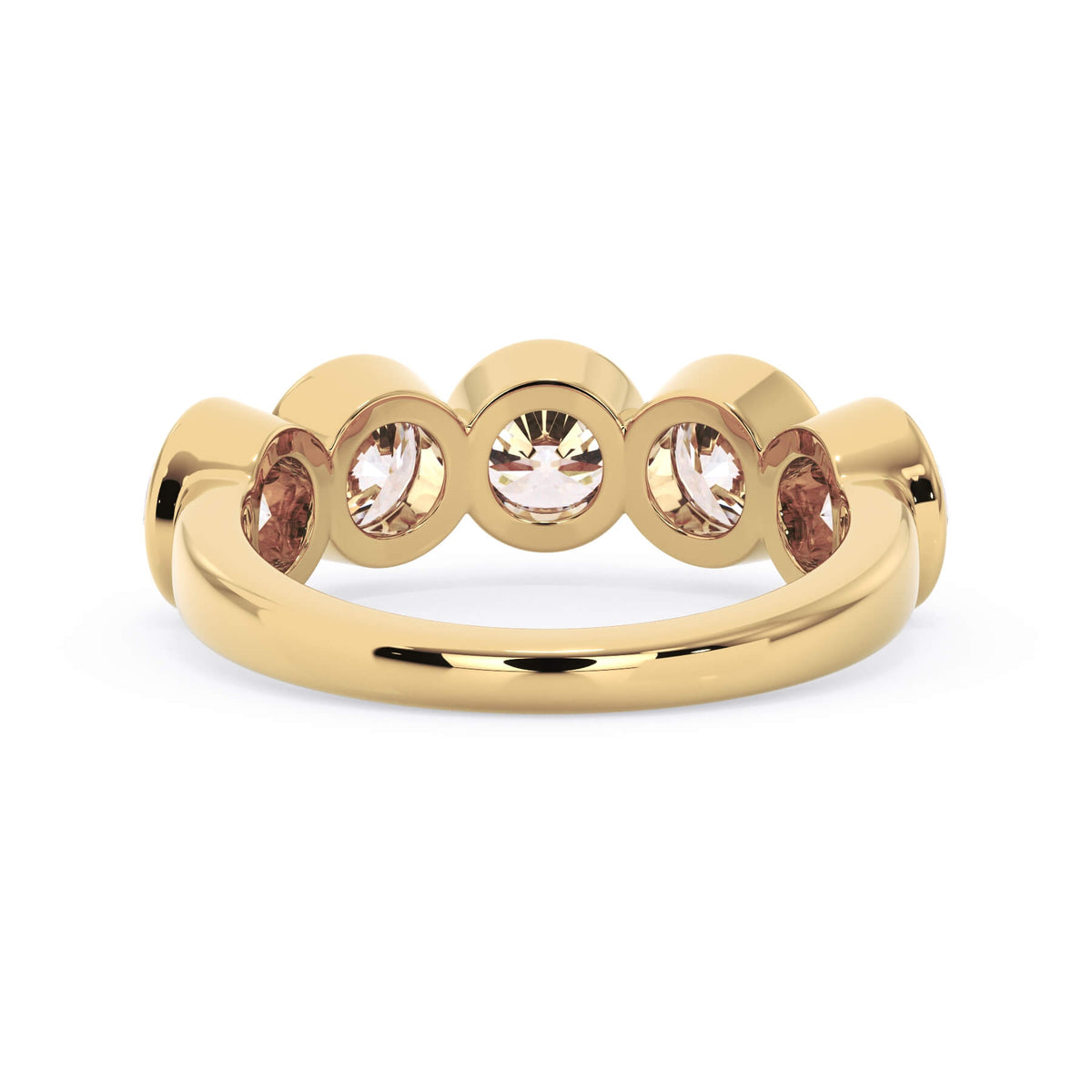 A picture of a five stone diamond wedding ring with round diamonds that are bezel set in yellow gold on a white background with a view of the underside of the ring.