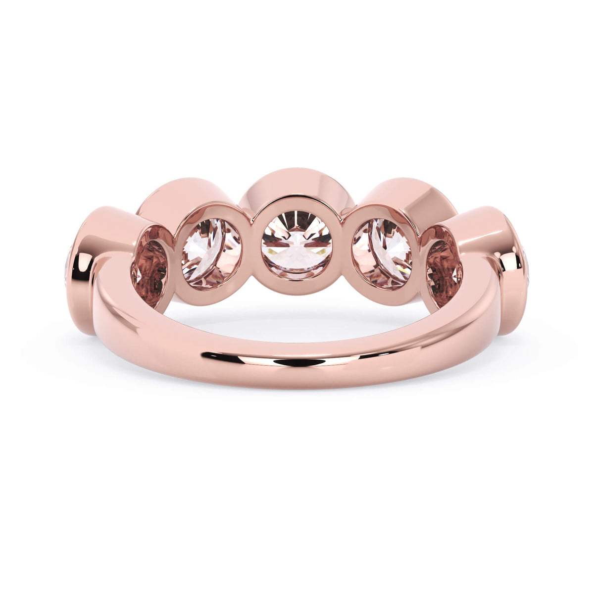 A picture of a five stone diamond wedding ring with round diamonds that are bezel set in rose gold on a white background with a view of the underside of the ring.