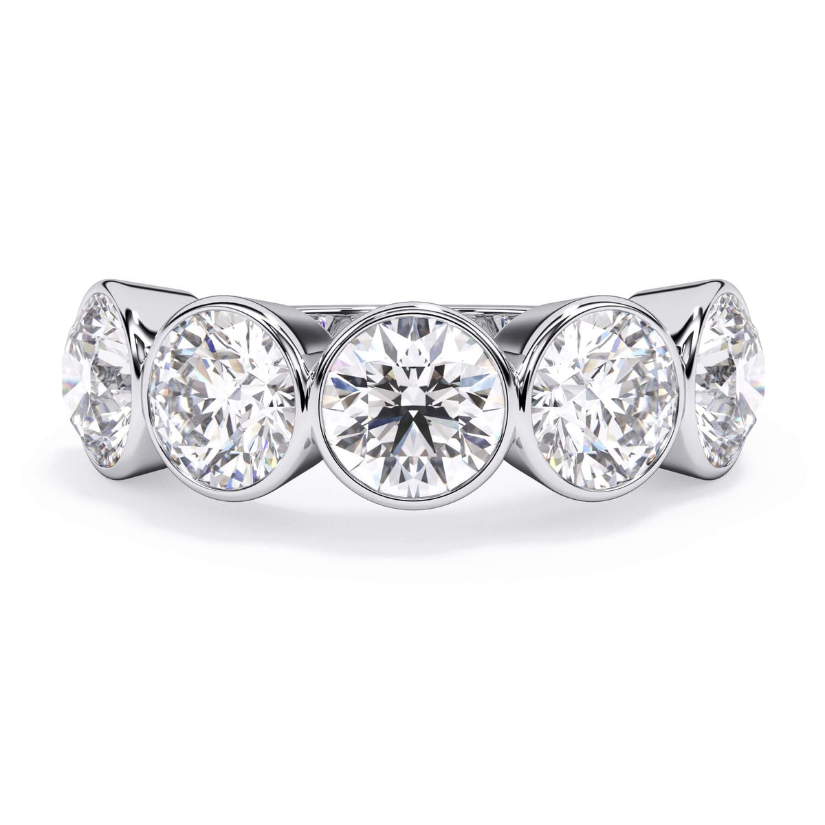 A picture of a five stone diamond wedding ring with round diamonds that are bezel set in white gold or platinum on a white background with the ring facing forward, lying down.