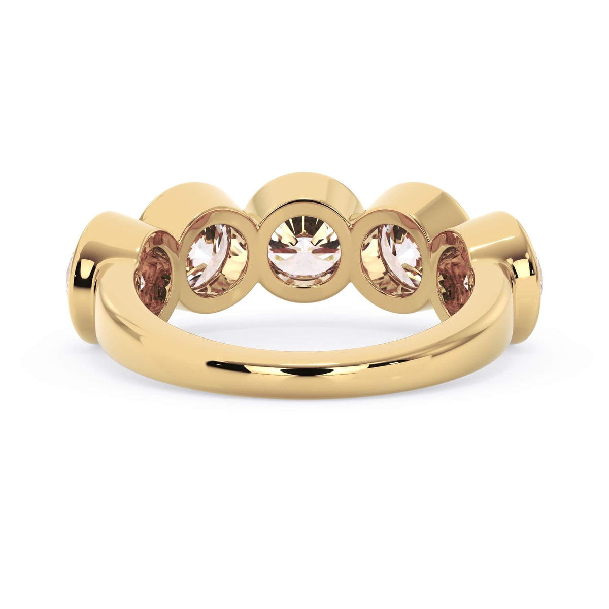 A picture of a five stone diamond wedding ring with round diamonds that are bezel set in yellow gold on a white background with a view of the underside of the ring.