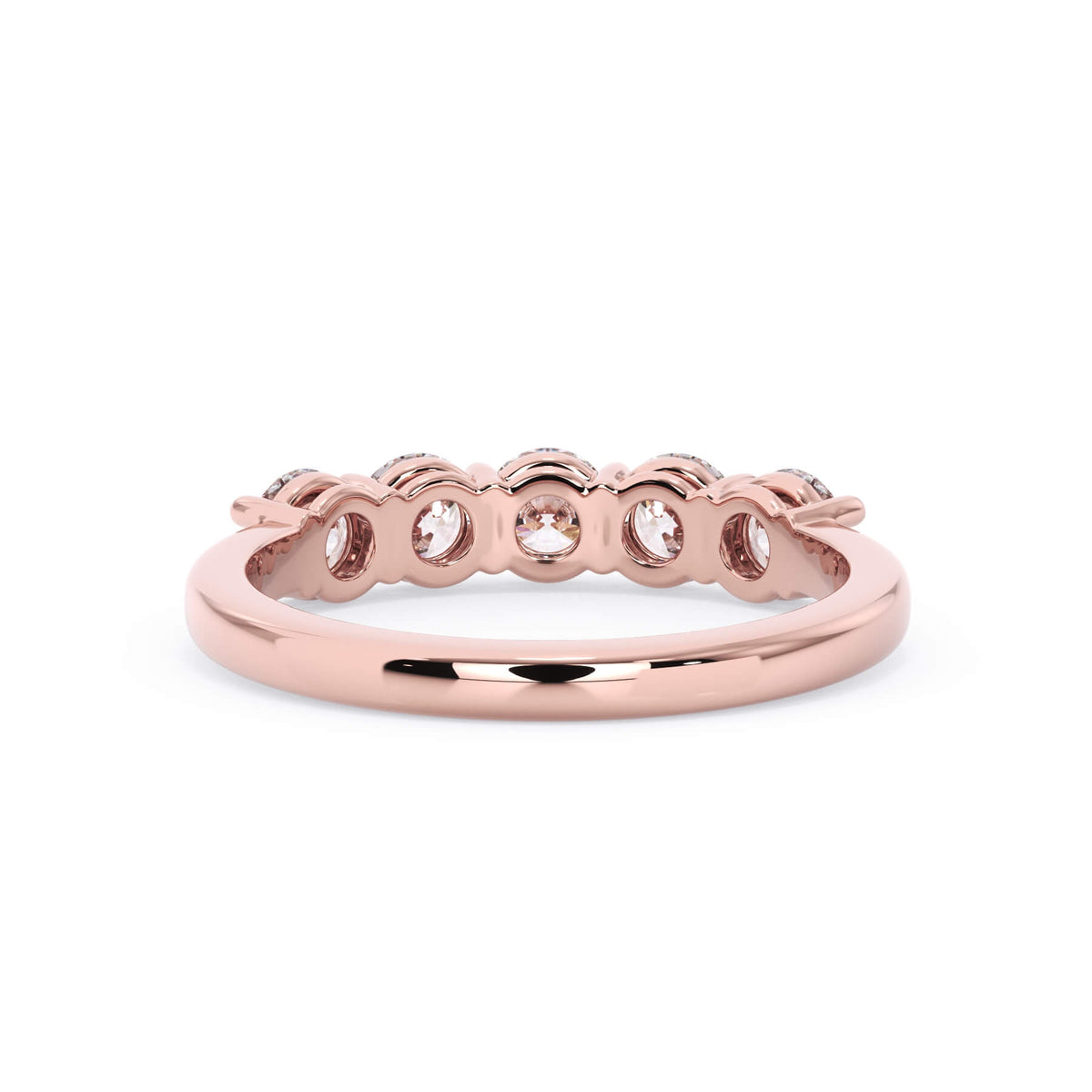 A picture of a five stone diamond wedding ring with round diamonds that are shared prong set in rose gold on a white background with a view of the underside of the ring.