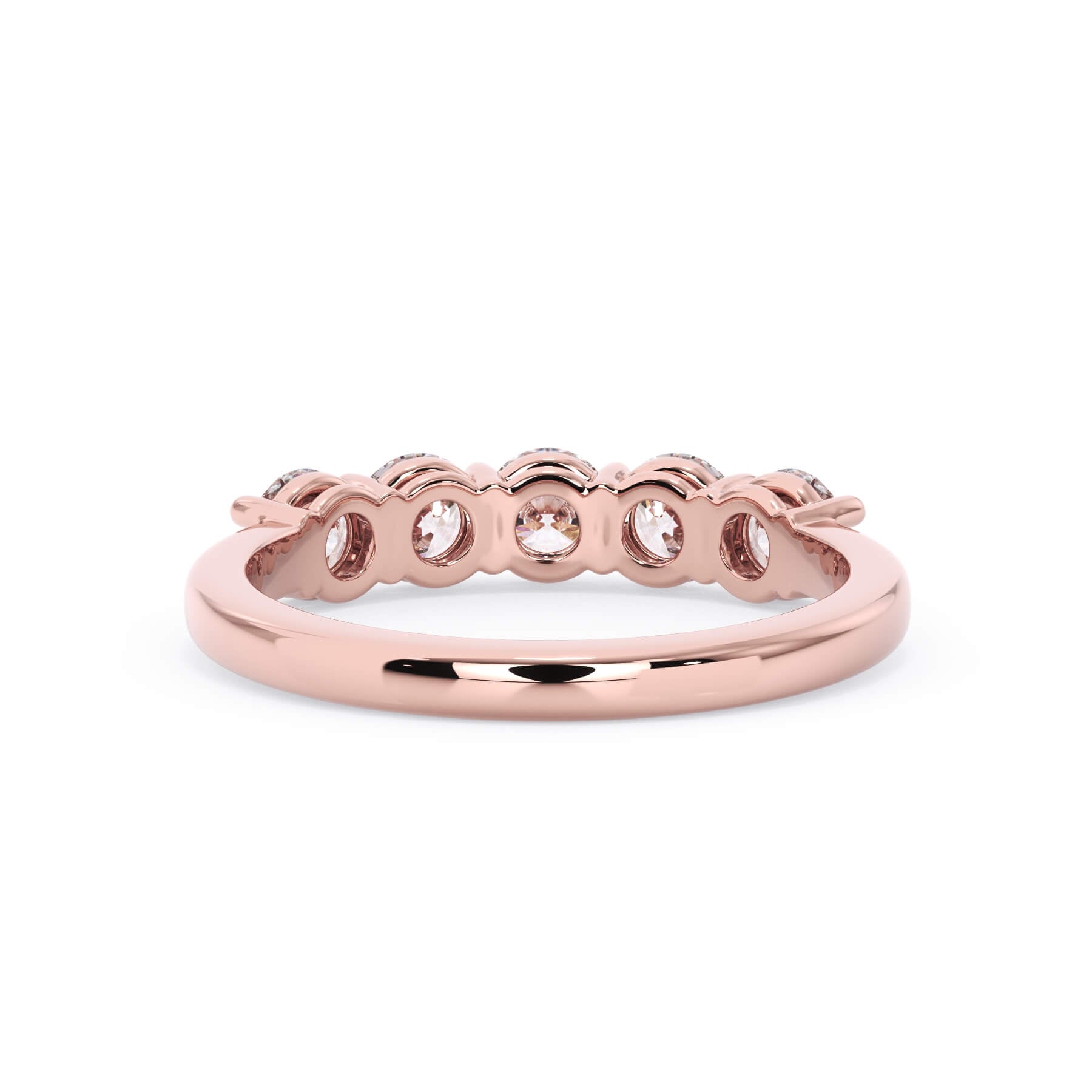 A picture of a five stone diamond wedding ring with round diamonds that are shared prong set in rose gold on a white background with a view of the underside of the ring.