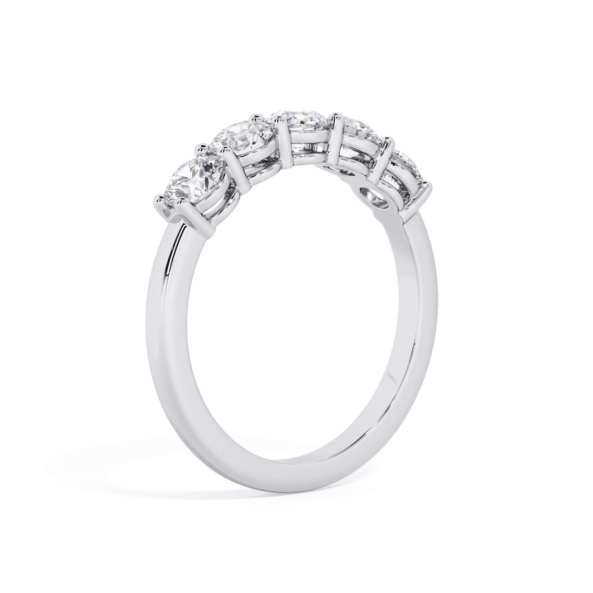 A picture of a five stone diamond wedding ring with round diamonds that are shared prong set in white gold or platinum on a white background with a slightly angled, through the finger view.