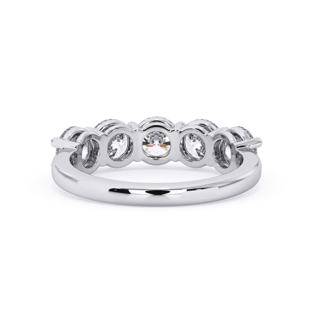 A picture of a five stone diamond wedding ring with round diamonds that are shared prong set in white gold or platinum on a white background with a view of the underside of the ring.