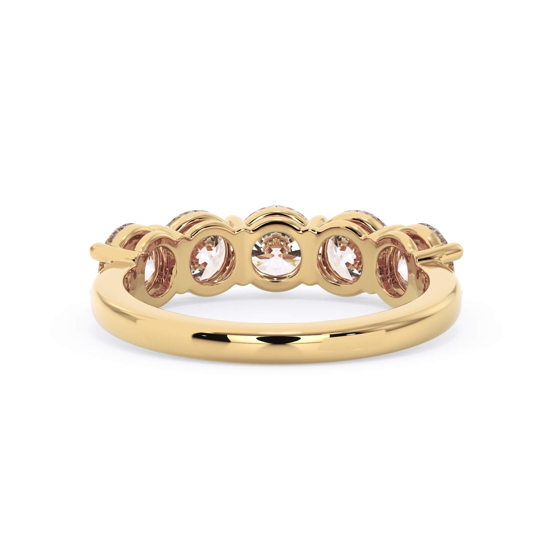 A picture of a five stone diamond wedding ring with round diamonds that are shared prong set in yellow gold on a white background with a view of the underside of the ring.