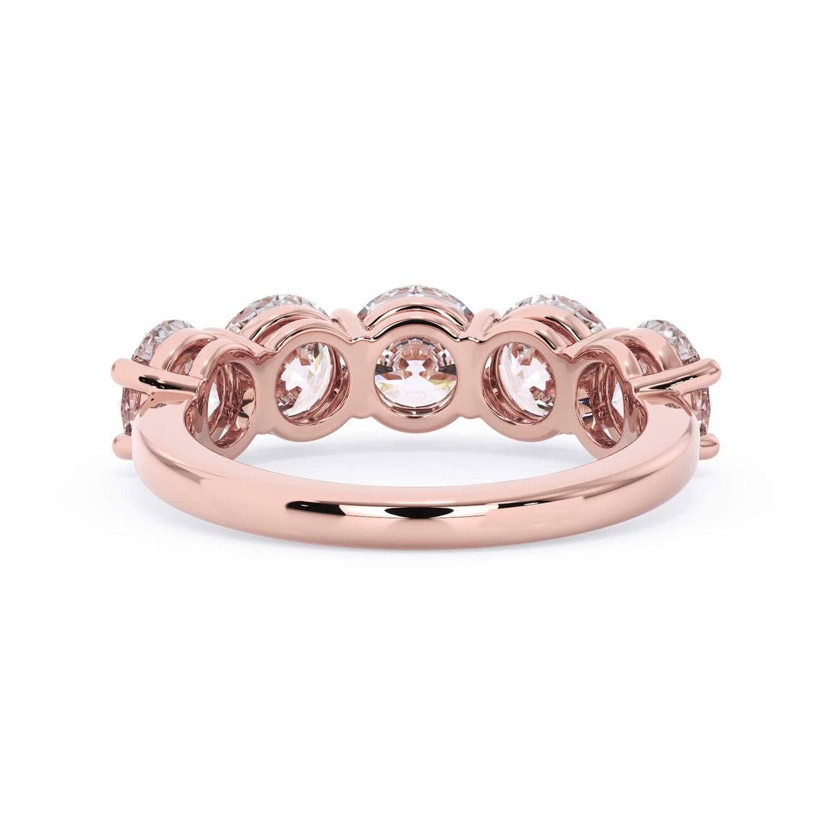 A picture of a five stone diamond wedding ring with round diamonds that are shared prong set in rose gold on a white background with a view of the underside of the ring.