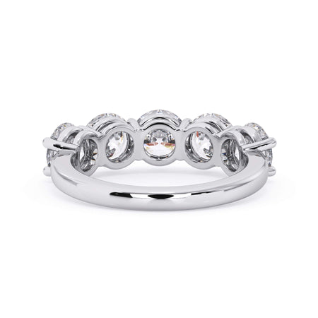 A picture of a five stone diamond wedding ring with round diamonds that are shared prong set in white gold or platinum on a white background with a view of the underside of the ring.