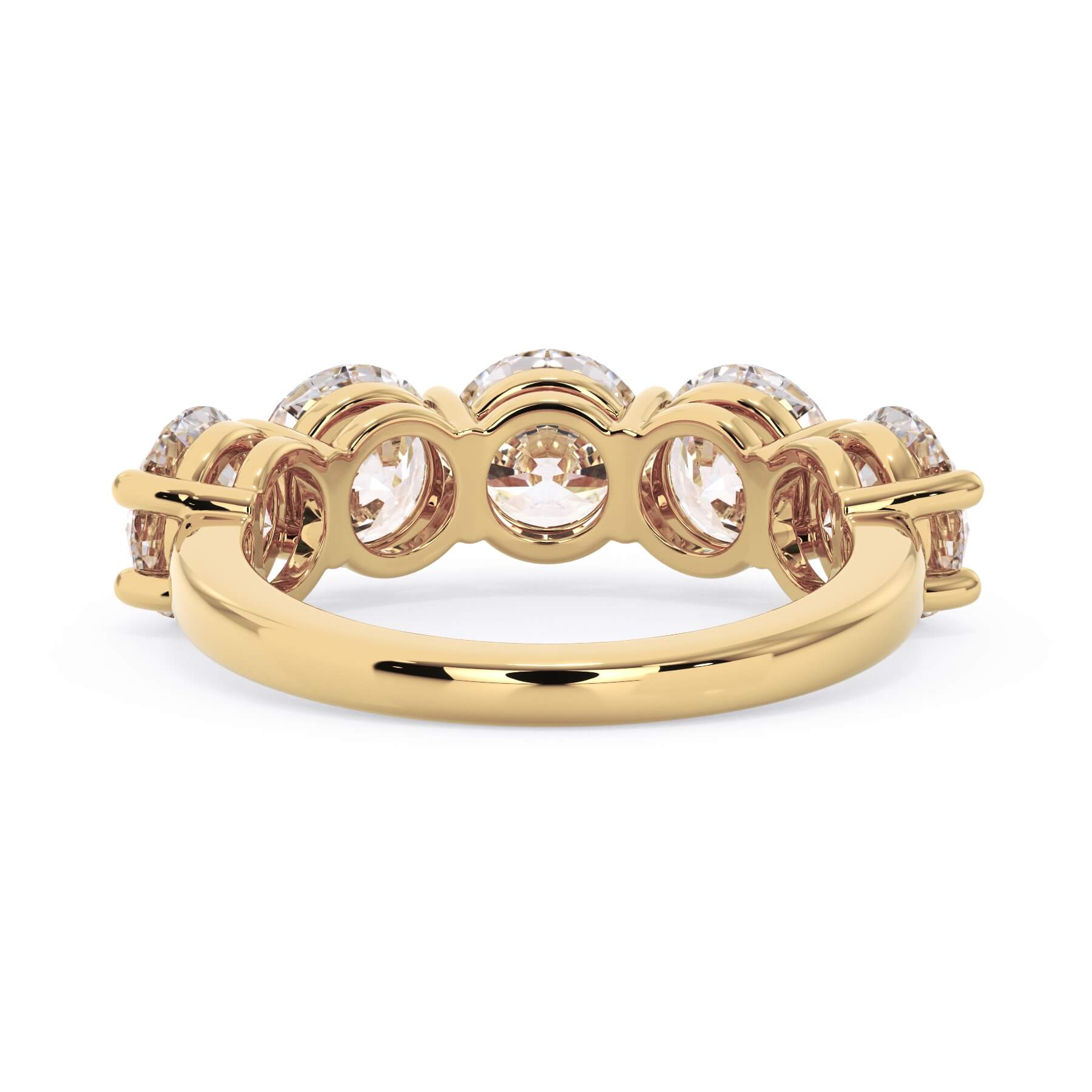A picture of a five stone diamond wedding ring with round diamonds that are shared prong set in yellow gold on a white background with a view of the underside of the ring.