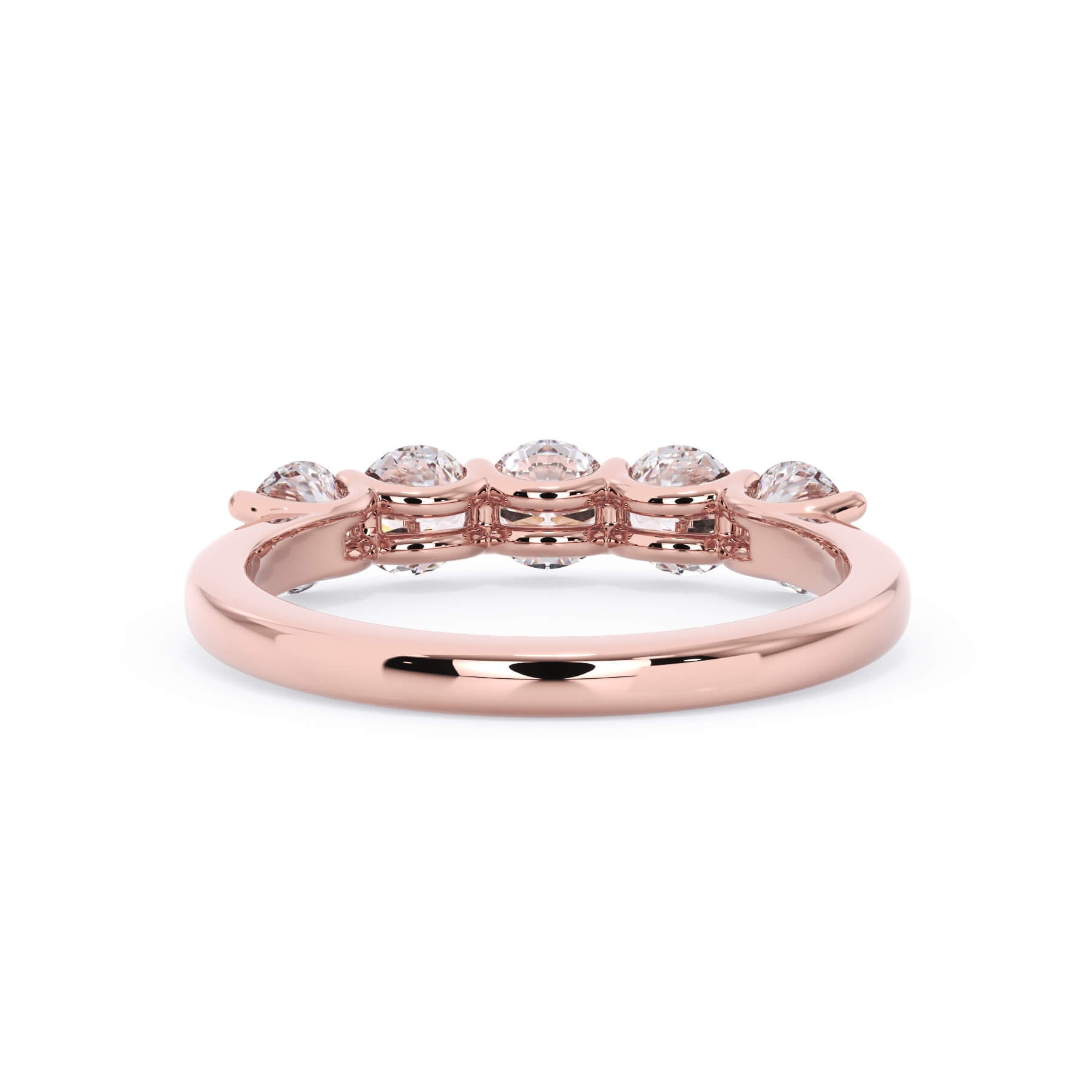 A picture of a five stone diamond wedding ring with round diamonds that are u prong set in rose gold on a white background with a view of the underside of the ring.
