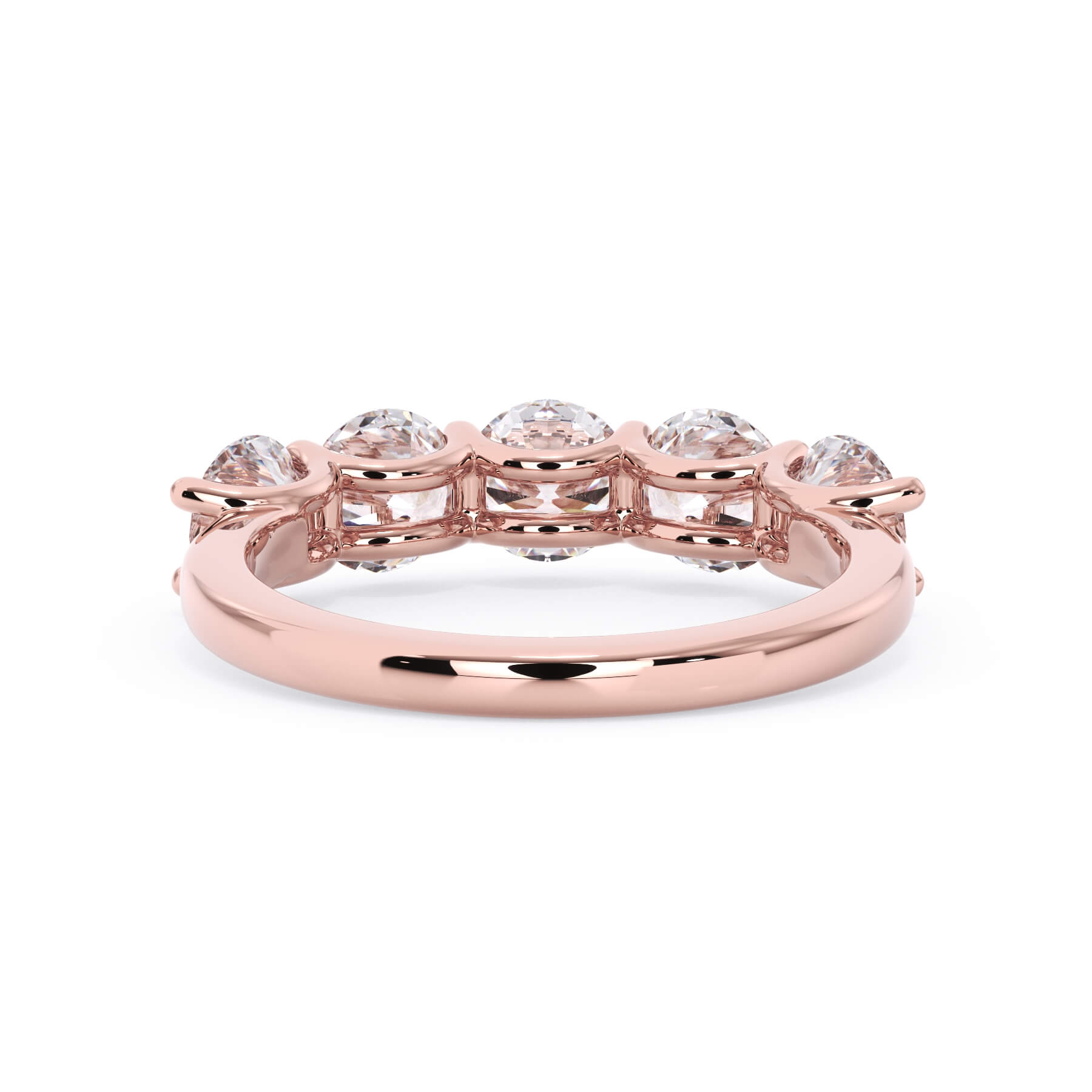 A picture of a five stone diamond wedding ring with round diamonds that are u prong set in rose gold on a white background with a view of the underside of the ring.