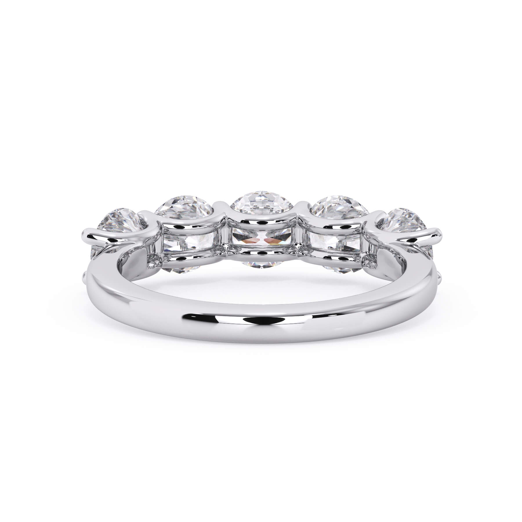 A picture of a five stone diamond wedding ring with round diamonds that are u prong set in white gold or platinum on a white background with a view of the underside of the ring.