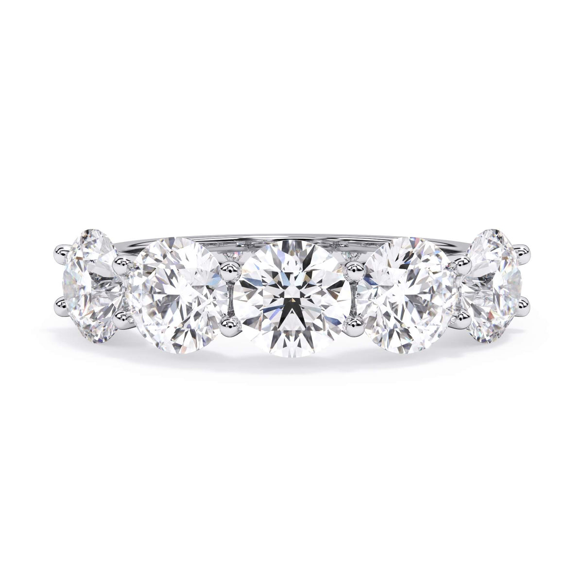 A picture of a five stone diamond wedding ring with round diamonds that are u prong set in white gold or platinum on a white background with the ring facing forward, lying down.