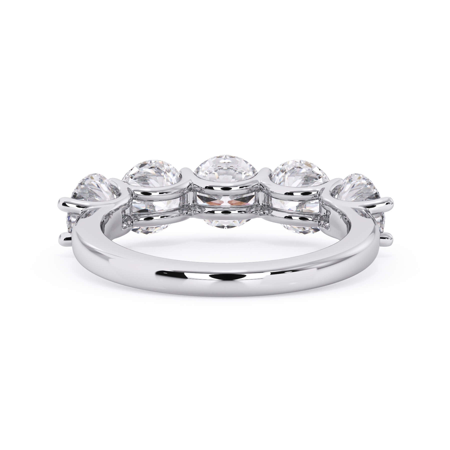 A picture of a five stone diamond wedding ring with round diamonds that are u prong set in white gold or platinum on a white background with a view of the underside of the ring.