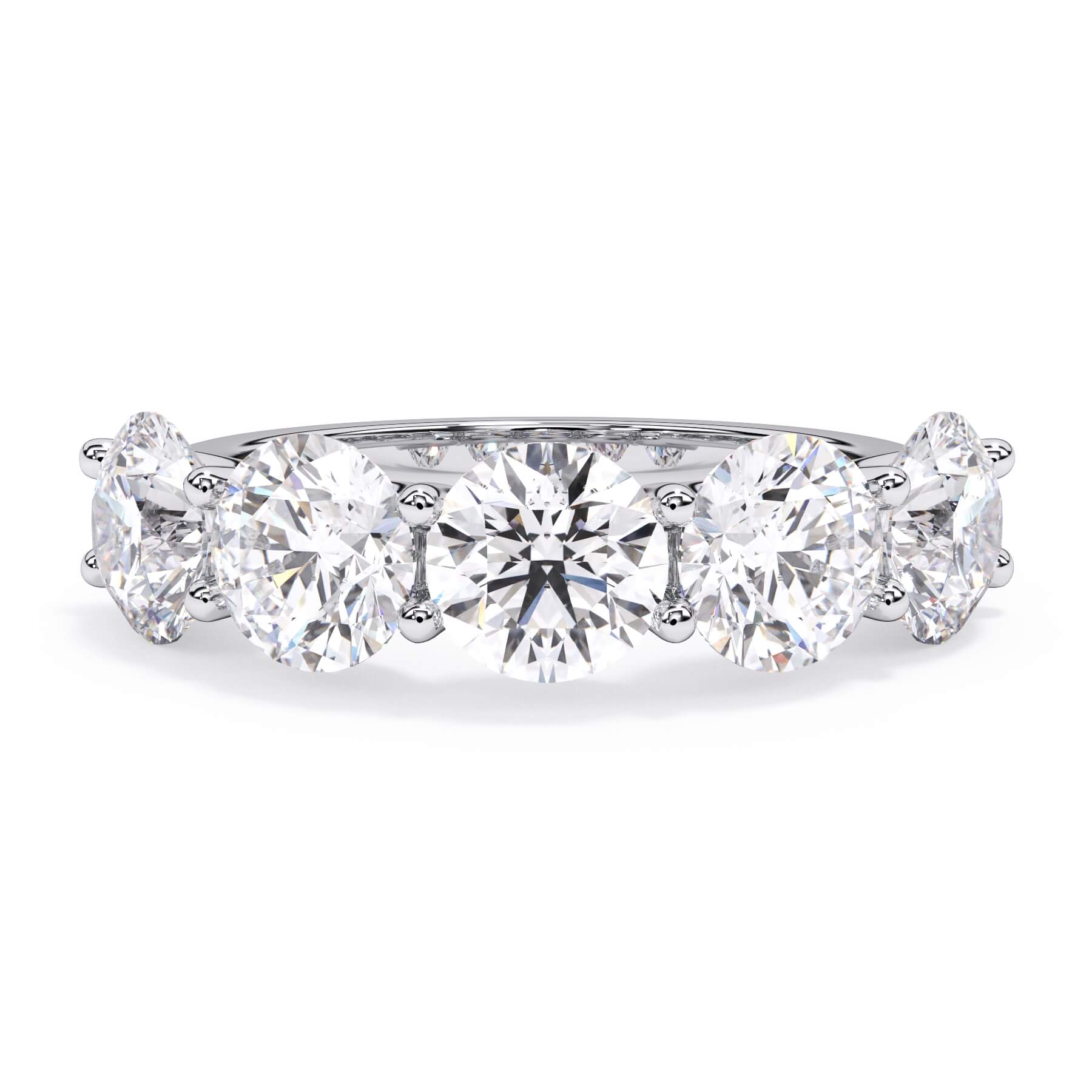 A picture of a five stone diamond wedding ring with round diamonds that are u prong set in white gold or platinum on a white background with the ring facing forward, lying down.