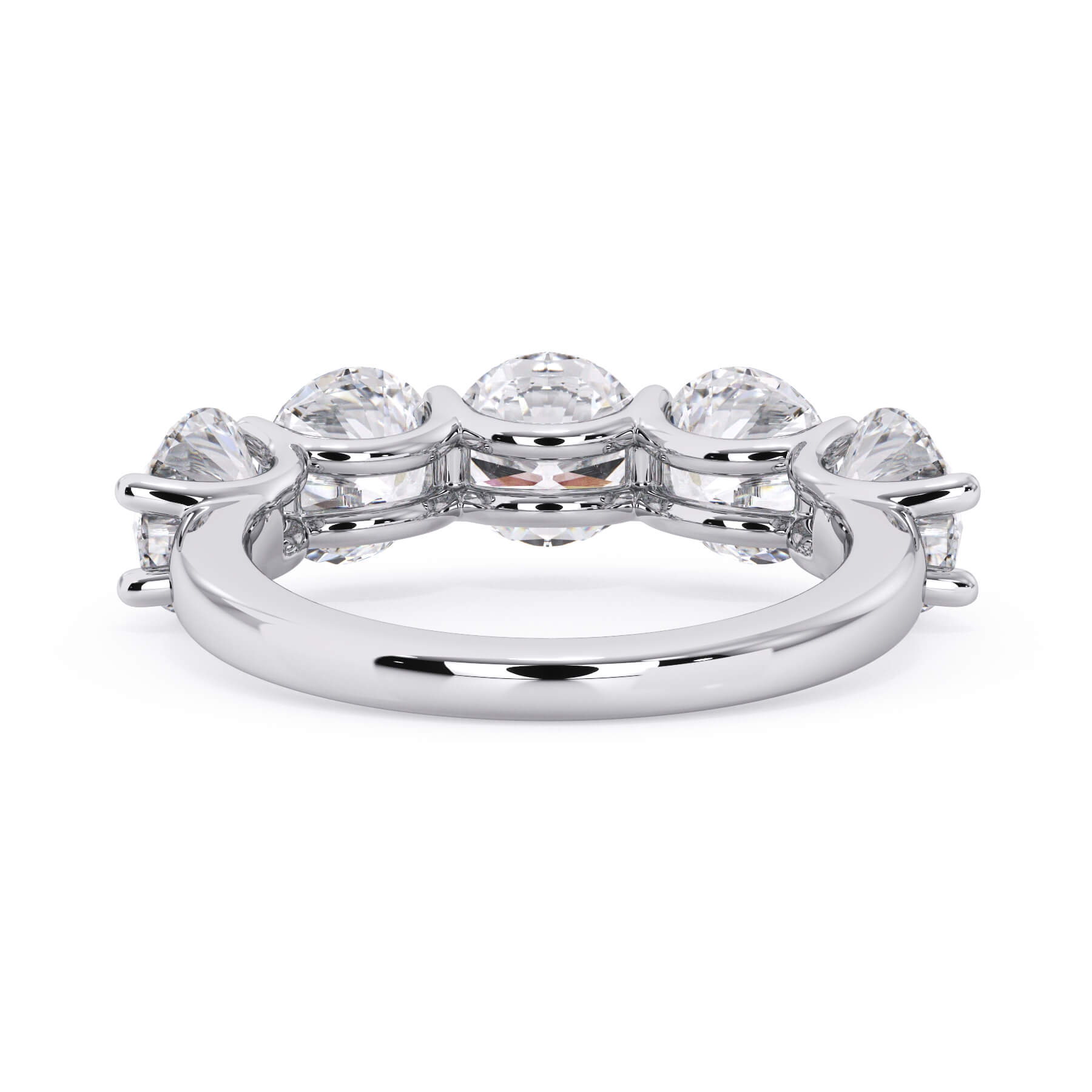 A picture of a five stone diamond wedding ring with round diamonds that are u prong set in white gold or platinum on a white background with a view of the underside of the ring.