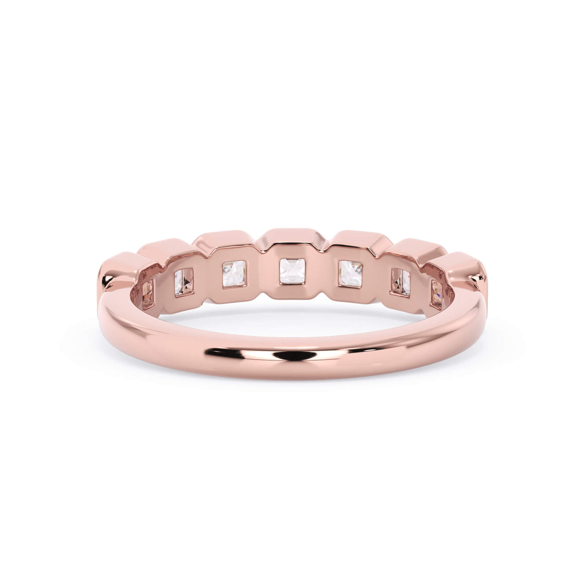 A picture of a seven stone diamond wedding ring with asscher cut diamonds that are bezel set in rose gold on a white background with a view of the underside of the ring.