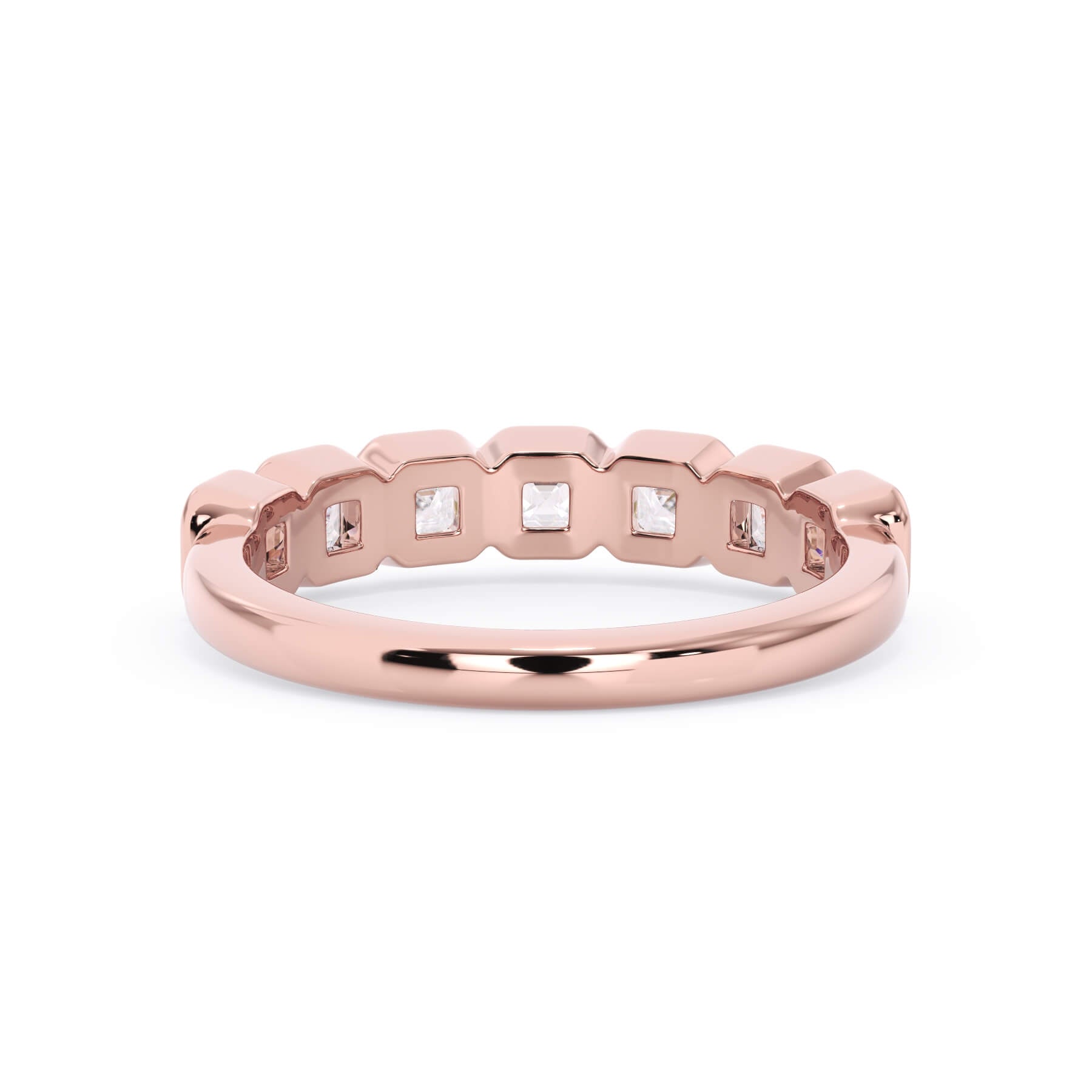A picture of a seven stone diamond wedding ring with asscher cut diamonds that are bezel set in rose gold on a white background with a view of the underside of the ring.