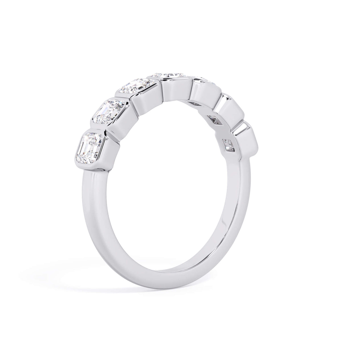 A picture of a seven stone diamond wedding ring with asscher cut diamonds that are bezel set in white gold or platinum on a white background with a slightly angled, through the finger view.