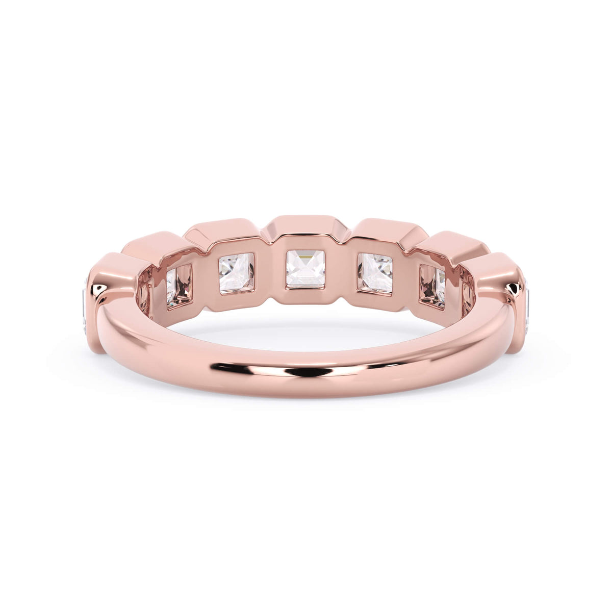 A picture of a seven stone diamond wedding ring with asscher cut diamonds that are bezel set in rose gold on a white background with a view of the underside of the ring.