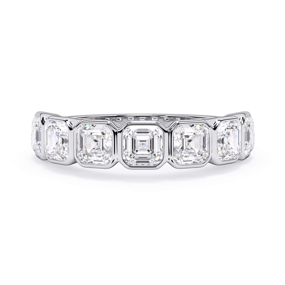 A picture of a seven stone diamond wedding ring with asscher cut diamonds that are bezel set in white gold or platinum on a white background with the ring facing forward, lying down.