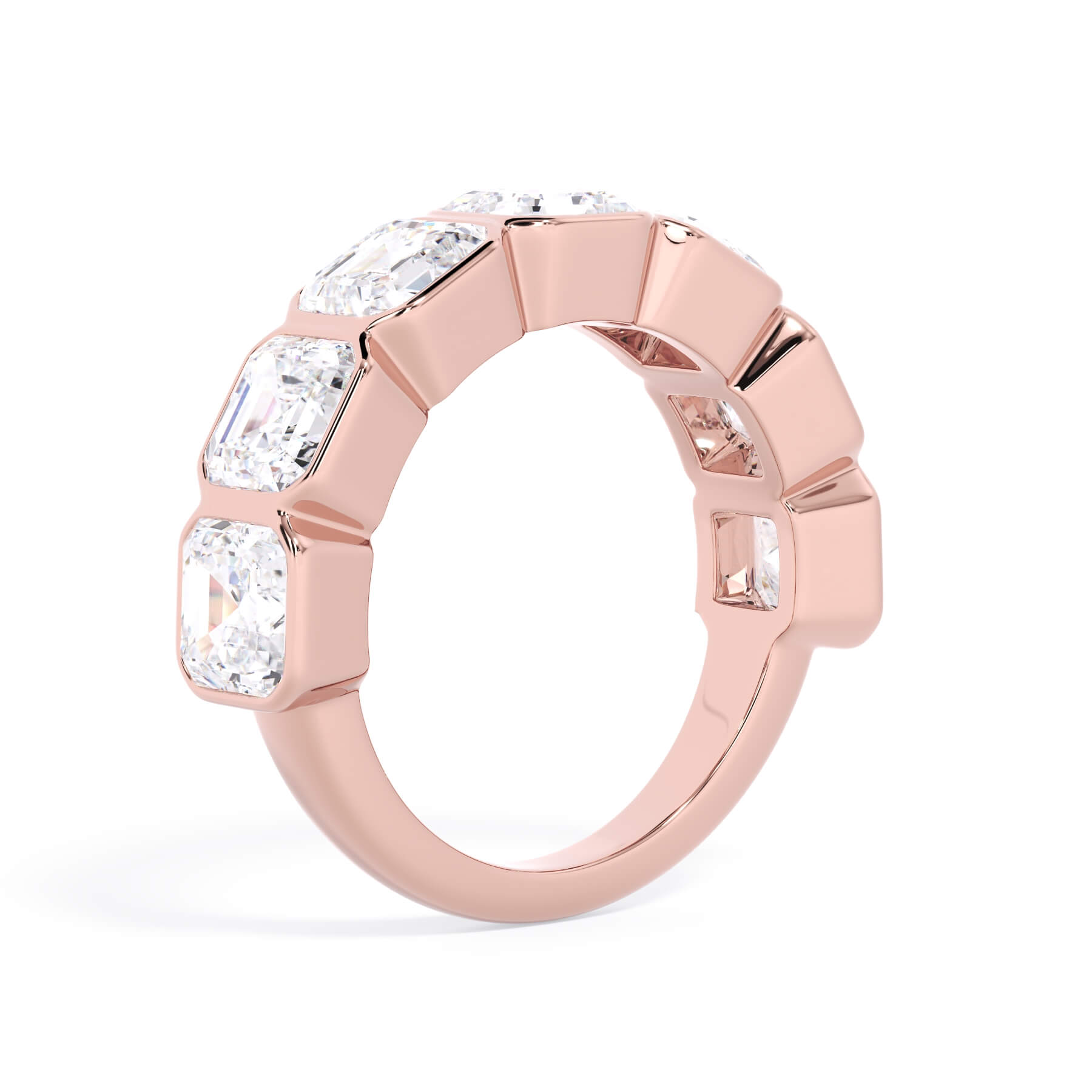 A picture of a seven stone diamond wedding ring with asscher cut diamonds that are bezel set in rose gold on a white background with a slightly angled, through the finger view.