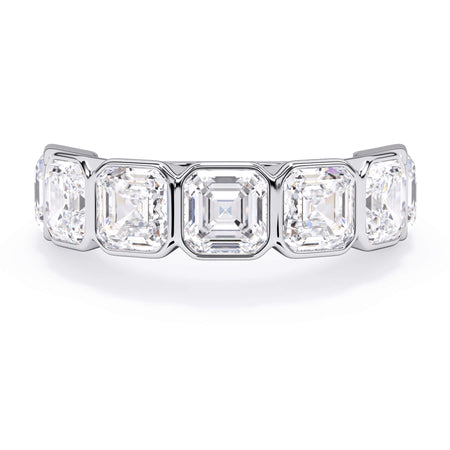 A picture of a seven stone diamond wedding ring with asscher cut diamonds that are bezel set in white gold or platinum on a white background with the ring facing forward, lying down.