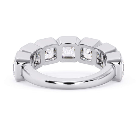 A picture of a seven stone diamond wedding ring with asscher cut diamonds that are bezel set in white gold or platinum on a white background with a view of the underside of the ring.