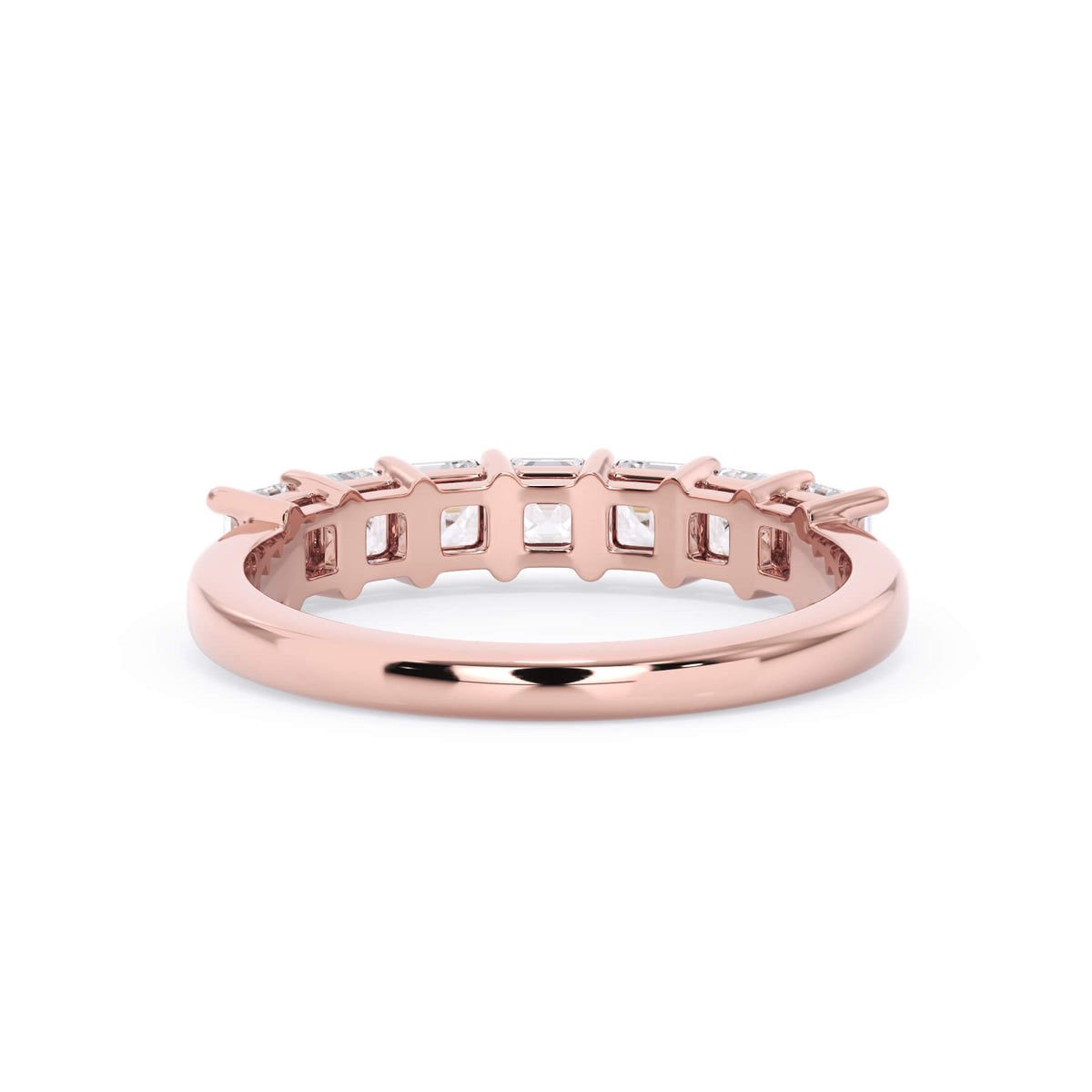 A picture of a seven stone diamond wedding ring with asscher cut diamonds that are shared prong set in rose gold on a white background with a view of the underside of the ring.