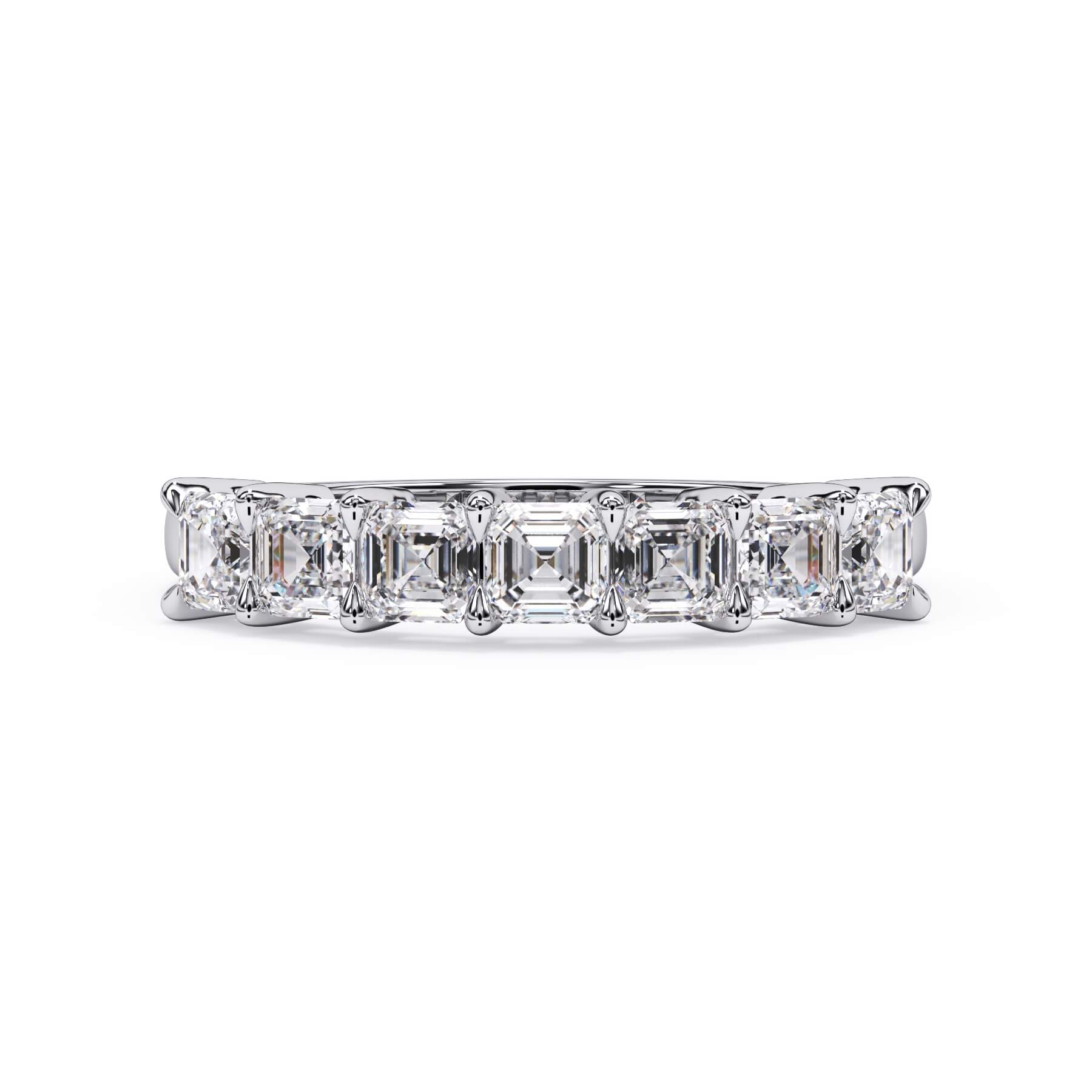 A picture of a seven stone diamond wedding ring with asscher cut diamonds that are shared prong set in white gold or platinum on a white background with the ring facing forward, lying down.