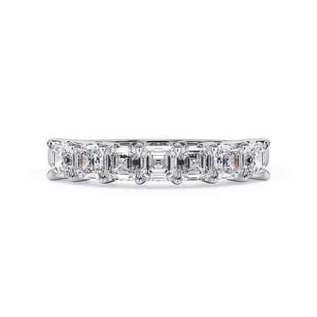 A picture of a seven stone diamond wedding ring with asscher cut diamonds that are shared prong set in white gold or platinum on a white background with the ring facing forward, lying down.