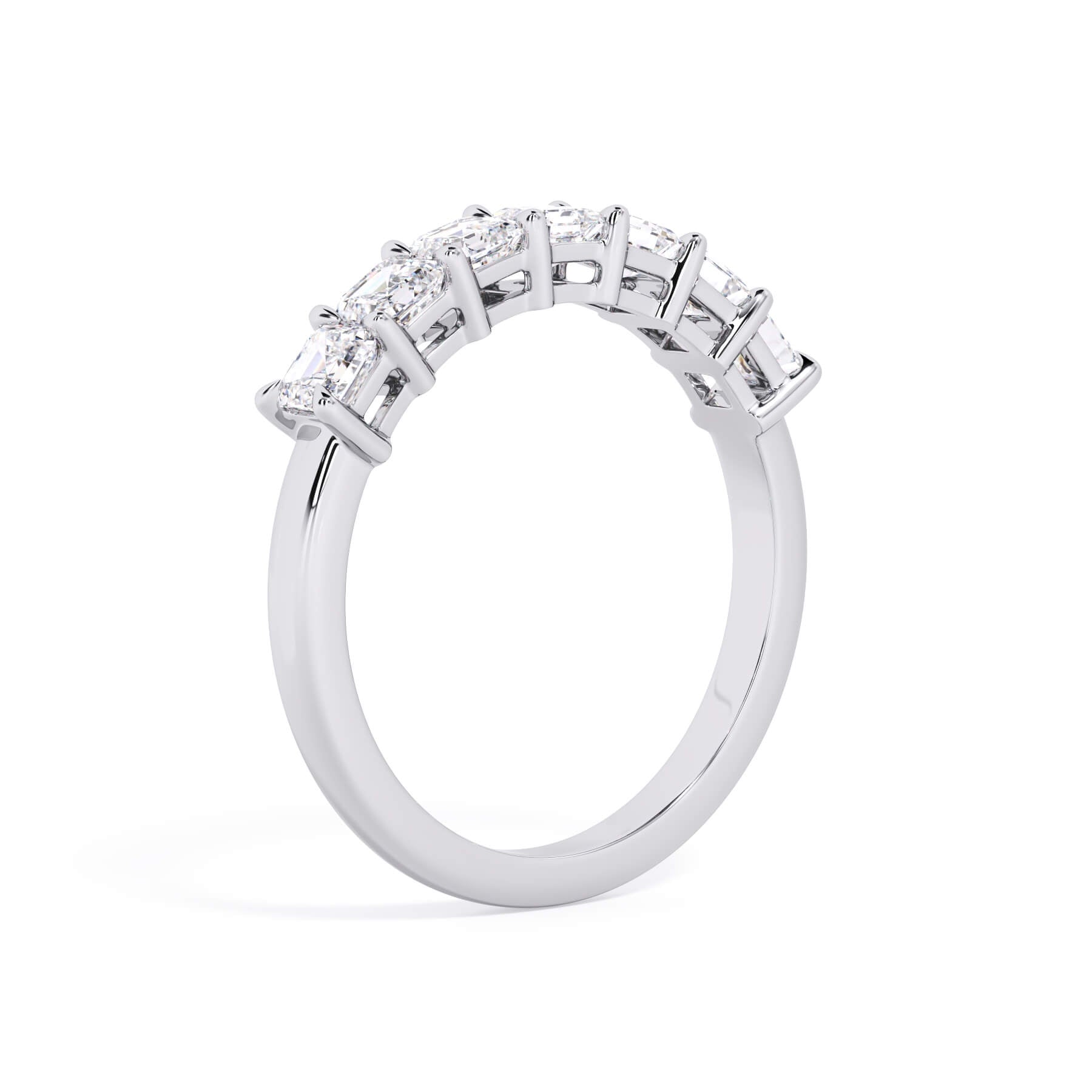 A picture of a seven stone diamond wedding ring with asscher cut diamonds that are shared prong set in white gold or platinum on a white background with a slightly angled, through the finger view.